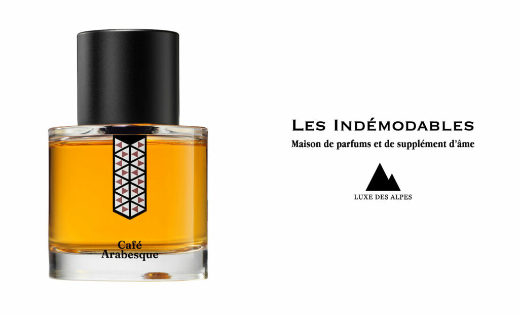 A bottle of the Café Arabesque perfume by Les Indémodables, featuring the brand’s logo