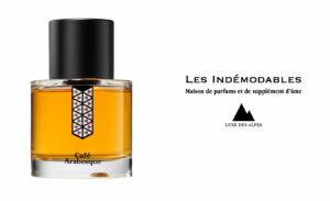 A bottle of the Café Arabesque perfume by Les Indémodables, featuring the brand’s logo